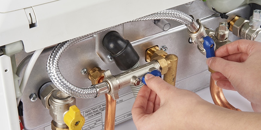 Alpha boiler being repaired by heating engineer